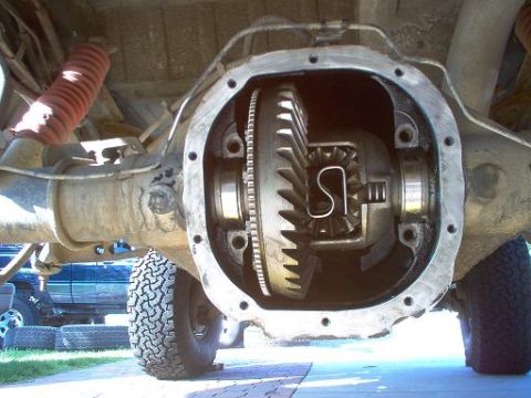 1988 Ford Bronco - Close-up of an open differential housing with gears exposed, showing internal mechanics.