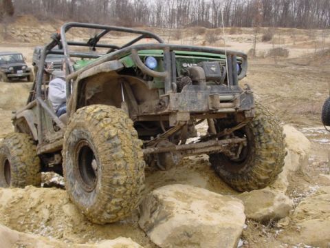 1992 Ford Bronco - This heavily modified off-road vehicle navigates a rocky obstacle course.