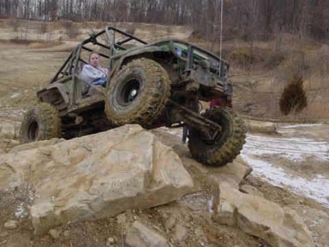 1992 Ford Bronco - Custom off-road buggy navigates a rocky obstacle course.