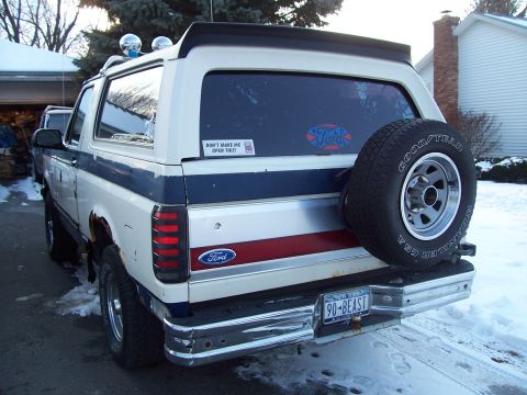 1990 Ford Bronco - This 1990 Ford Bronco is seen from the rear, a spare tire and a custom license plate.