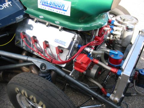 1997 Ford Crown Victoria - Custom engine bay Holbrook branded components and a prominent green body panel.