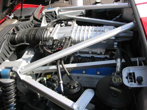 1997 Ford Crown Victoria - Close-up view of a supercharged engine bay, highlighting the intake and engine components.