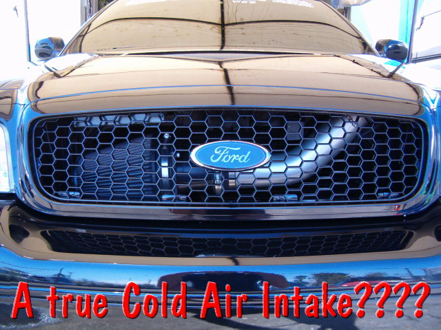 Black Ford honeycomb grille with blue Ford oval, captioned about a cold air intake