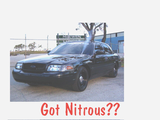 Black Ford Crown Victoria Police Interceptor sedan with red 'Got Nitrous??' caption text