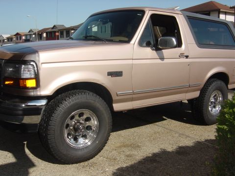 1996 Ford Bronco - This 1996 Ford Bronco is shown from the front three-quarter view, parked on a paved surface.