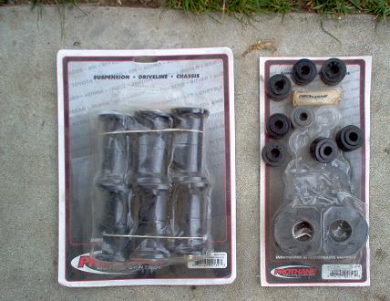 1988 Ford Bronco - Two packages of Prothane suspension bushings are displayed on a concrete surface, with grass in the background.