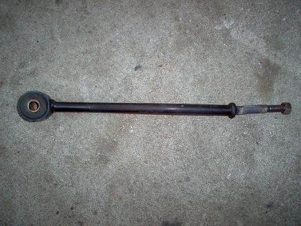 1988 Ford Bronco - A single automotive leaf spring bushing assembly is shown lying on a concrete surface.