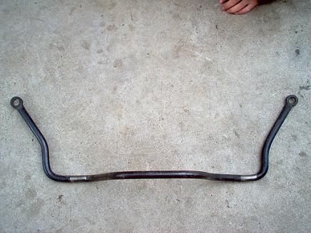 1988 Ford Bronco - A sway bar, likely a vehicle suspension component, is shown on a concrete floor.