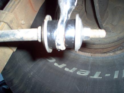 1988 Ford Bronco - Close-up of a leaf spring bushing on a 1988 Ford Bronco, likely during maintenance.