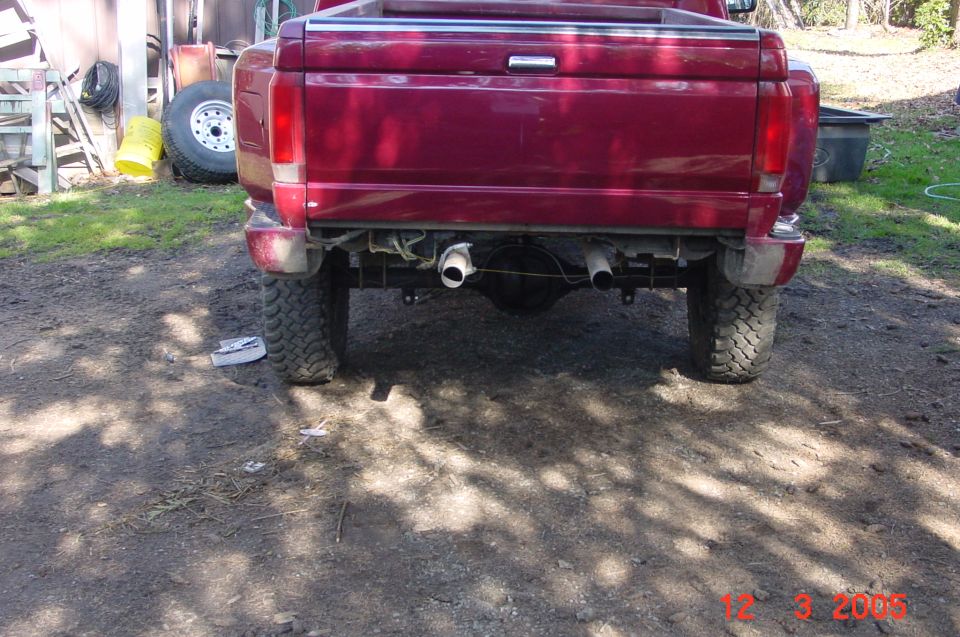 Red 1992 Ford F-150 rear view with dual exhaust