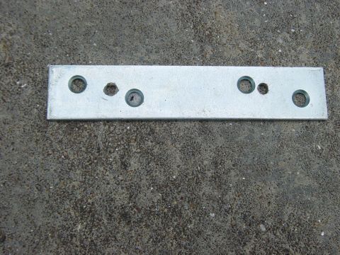 1988 Ford Bronco - After drilling the hinge. It's hard to tell, but my holes are the smaller two.