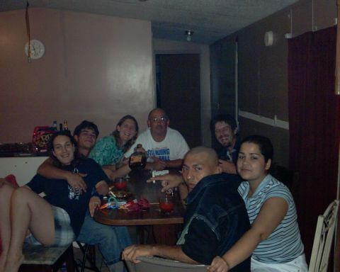 1978 Ford Bronco - A group of friends and family enjoy a gathering around a table, with drinks and conversation.