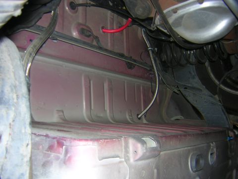 1992 Ford Crown Victoria - Underside view of a vehicle's chassis with visible wiring and suspension parts.