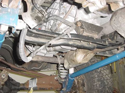 1995 Ford Bronco - Underside view shows transmission, suspension, and driveshaft components of a vehicle.