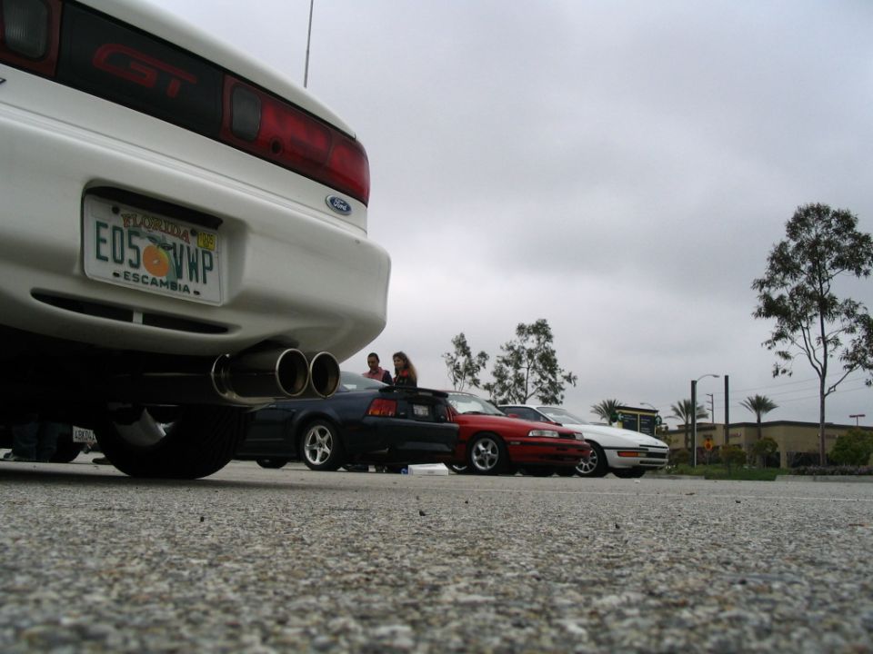 White 1995 Ford Probe GT rear view with dual exhaust and Florida license plate E05 VWP