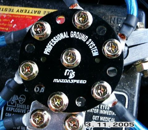 1993 Mazda MX-6 - A close-up view of a Mazdaspeed professional ground system, multiple connection points for wiring.