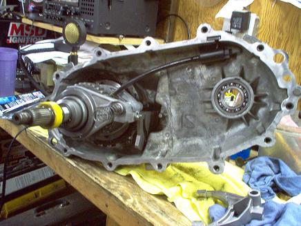 1988 Ford Bronco - Close-up view of a disassembled transfer case, showing internal components and a bearing.