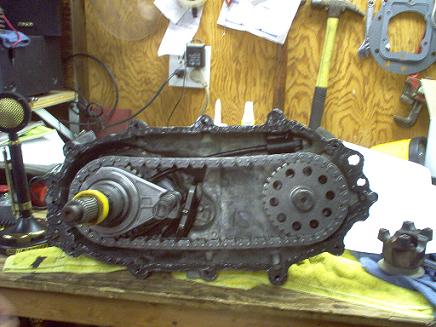 1988 Ford Bronco - A disassembled transfer case, likely for a vehicle, is shown on a workbench.