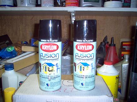 1988 Ford Bronco - Two cans of Krylon Fusion spray paint are displayed on a shelf with other items.