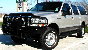 2002 Ford Excursion - This 2002 Ford Excursion is shown from the front three-quarter view, equipped with a brush guard and roof rack.
