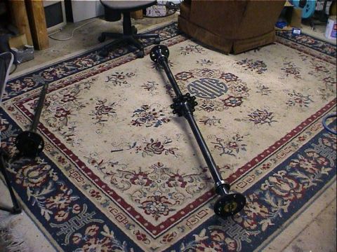1979 Ford Bronco - Driveshaft assembly on a rug, possibly for a vehicle upgrade.