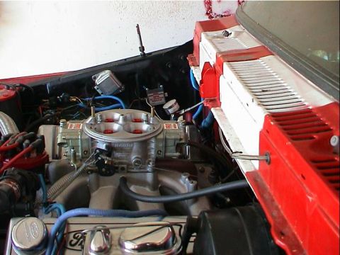 1979 Ford Bronco - Close-up view of a modified engine bay, a Holley carburetor and Ford branded valve covers.