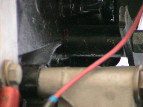 1979 Ford Bronco - A close-up view of engine bay components, including a prominent red wire, is visible.