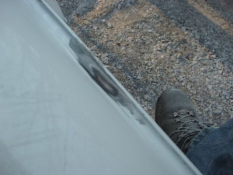 1995 Ford C-350 (Centurion Conversions) - Take a look at how deep the bondo is in the rain gutter.
