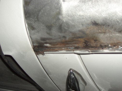 Bead of cold weld to cover crack between roof and gutter.