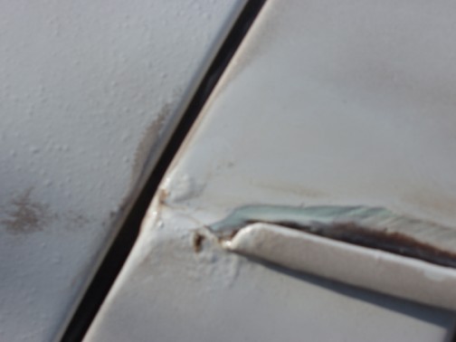 Note the bubbling paint, tells me there's rust underneath and needs investigating.