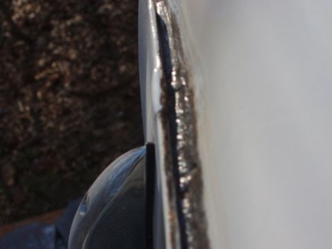 1995 Ford C-350 (Centurion Conversions) - Take a look at all the metal from the roof seam that filled in the gutter, it'll be ground down to allow the gutter to function correctly.