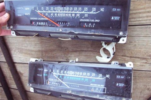 1985 Ford LTD Crown Victoria - Two automotive instrument clusters are displayed, speedometers and fuel level indicators.