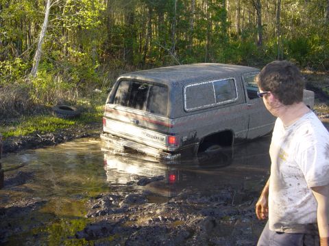 1989 Ford Bronco - This Chevrolet K5 Blazer is deeply stuck in mud, with only its upper body visible.