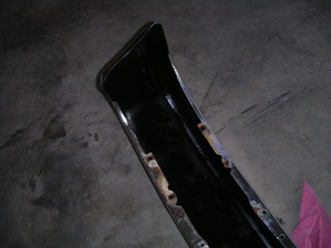 1994 Ford Bronco - A black bumper with chrome trim is shown, likely a replacement part for a vehicle.