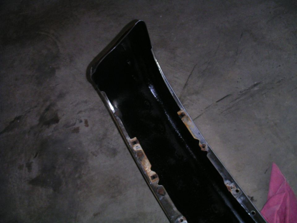 Black bumper with chrome trim and mounting points