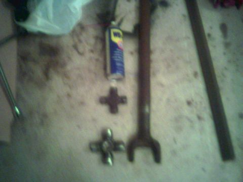 1987 Ford Bronco - 35 spline dana 60 long side shaft with a new 1480? ujoint. the smaller ujoint is a 1330 for size reference, and a can of wd40