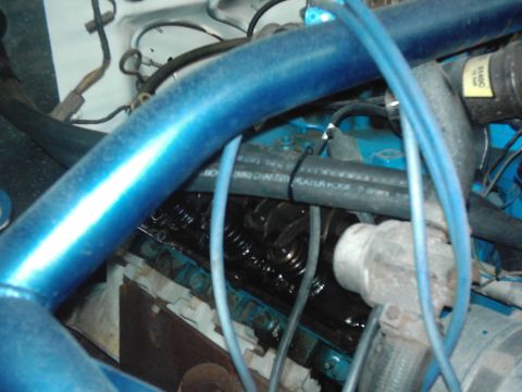 1978 Ford Bronco - View of the engine bay, showing various hoses, wires, and engine components.