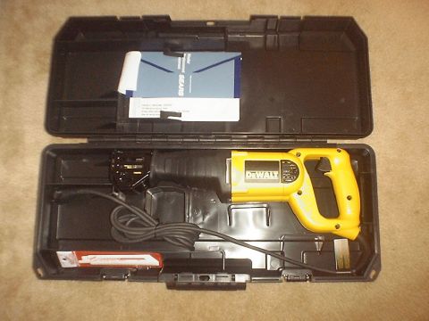 1989 Ford Bronco - A yellow DeWalt reciprocating saw is shown inside its black carrying case, alongside Sears documentation and accessories.