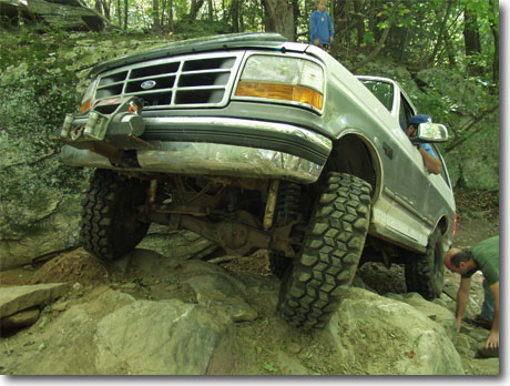 1995 Ford Bronco - This 1995 Ford Bronco navigates a challenging rocky trail, its off-road capabilities.
