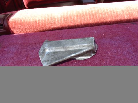 1993 Ford Probe - A bent metal bracket is visible on the seat of a vehicle.
