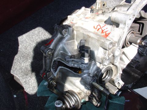 1993 Ford Probe - Close-up of a disassembled transmission part with visible internal components and red markings.