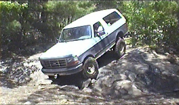 1995 Ford Bronco - This 1995 Ford Bronco is navigating a challenging rocky terrain.