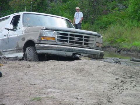 1995 Ford Bronco - This 1995 Ford Bronco is stuck deep in the mud during an off-road excursion.
