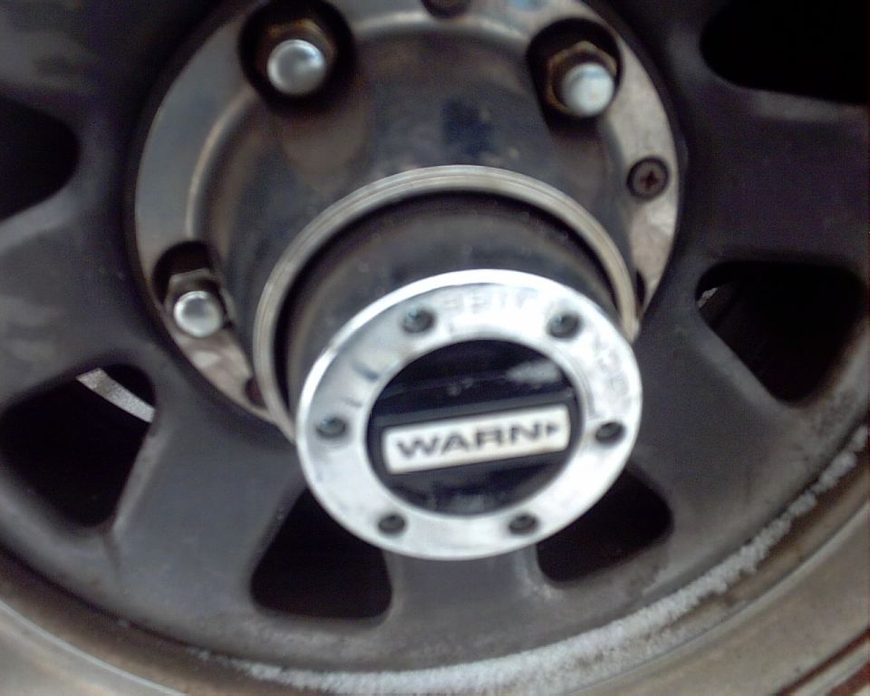 Wheel hub with WARN branding, close-up view