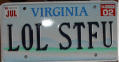 1968 Ford Mustang - Virginia vanity license plate reading "LOL STFU" in blue characters on a white plate, with July 2002 registration stickers in the upper cor…