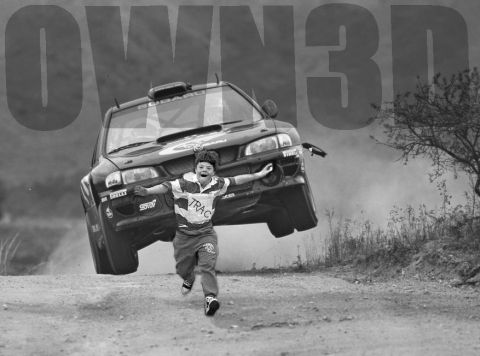 1968 Ford Mustang - Black-and-white photo of a Subaru Impreza rally car airborne over a dirt road, captured head-on with the front wheels off the ground, while…