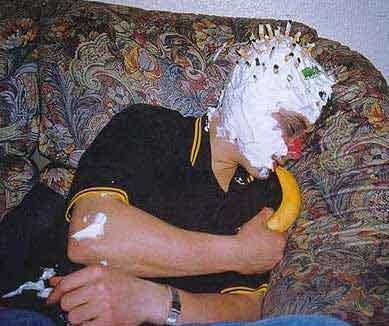 1968 Ford Mustang - A person lies on a couch with their face covered in shaving cream and a banana in their hand.