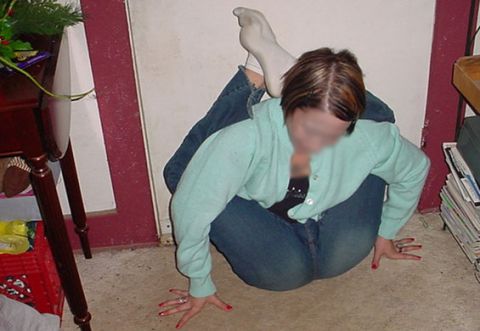 1968 Ford Mustang - A woman is photographed in an unusual, contorted position on a carpeted floor, with a stack of magazines nearby.