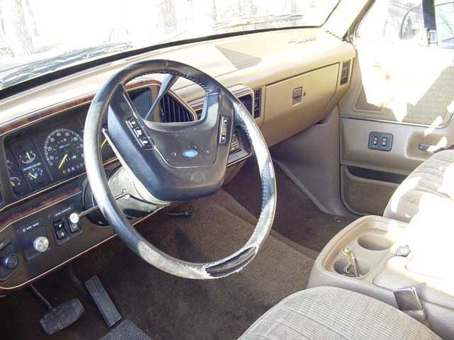 1989 Ford Bronco interior showing dashboard, steering wheel, and seats