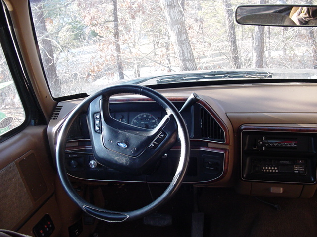 1989 Ford Bronco interior with tan dashboard and steering wheel